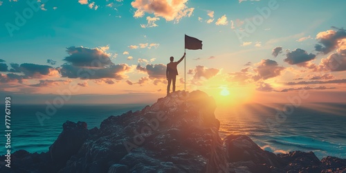 A man is standing on top of a mountain holding a flag
