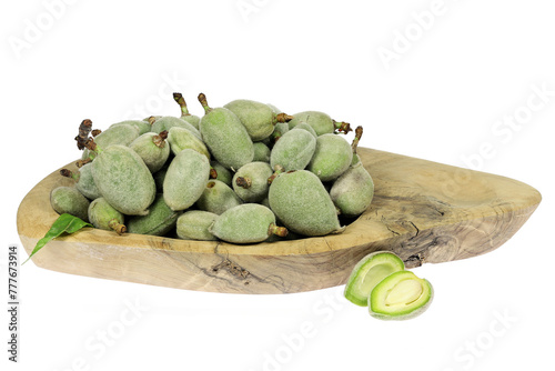 green almonds (cagla badem) from Turkey in a wooden bowl isolated on white background