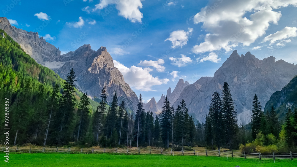 Scenic view of majestic rugged mountain peaks of Sexten Dolomites, Bolzano, South Tyrol, Italy, Europe. Hiking in panoramic Fischleintal near Moos, Italian Alps. Idyllic conifer forest. Tranquil scene