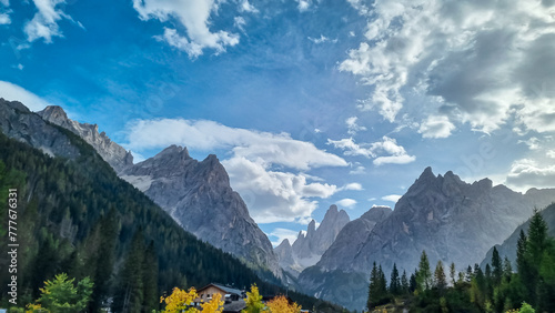 Scenic view of majestic rugged mountain peaks of Sexten Dolomites, Bolzano, South Tyrol, Italy, Europe. Hiking in panoramic Fischleintal near Moos, Italian Alps. Idyllic conifer forest. Tranquil scene photo