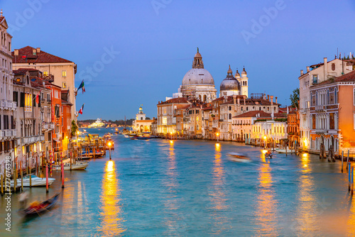 Basilica of Santa Maria della Salute and Grand Canal in Venice at night, Italy photo