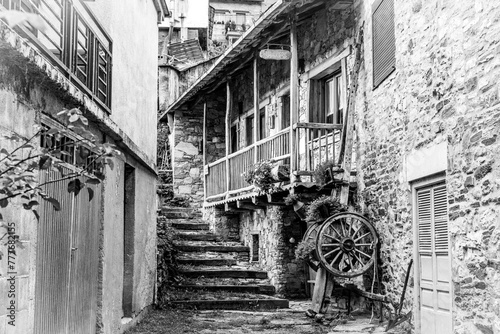 monochrome of a narrow street with stairs in a medieval old town 