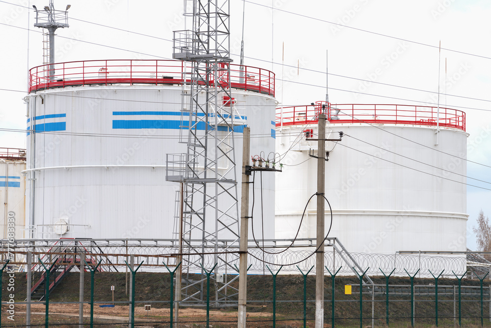 Treatment, pumping and temporary storage of crude oil. Vertical steel tanks on a fenced guarded site. Treatment, pumping and temporary storage of crude oil. Vertical steel tanks on a fenced guarded site.