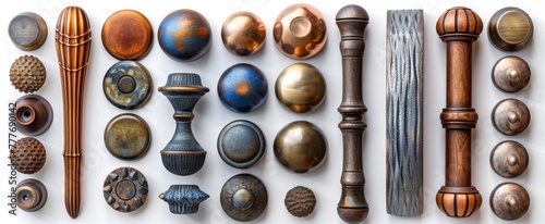 Collection of decorative furniture handles in mixed finishes. Ornate metal knobs and pulls on white backdrop. Concept of cabinetry hardware, interior design variety, home fittings. Top view. Flat lay
