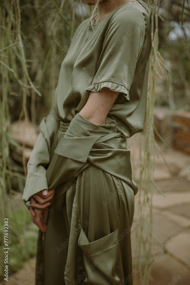 A Woman Poses In A Tropical Garden A Woman Poses In A Tropical Garden