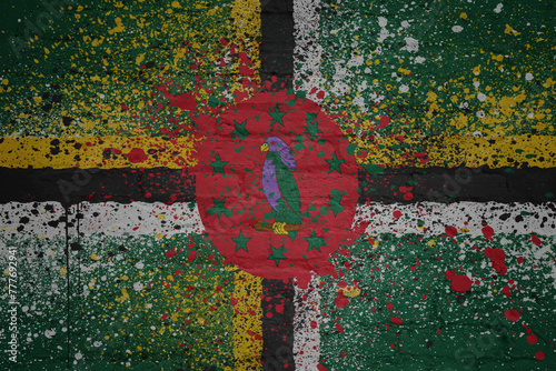 painted big national flag of dominica on a massive old brick wall