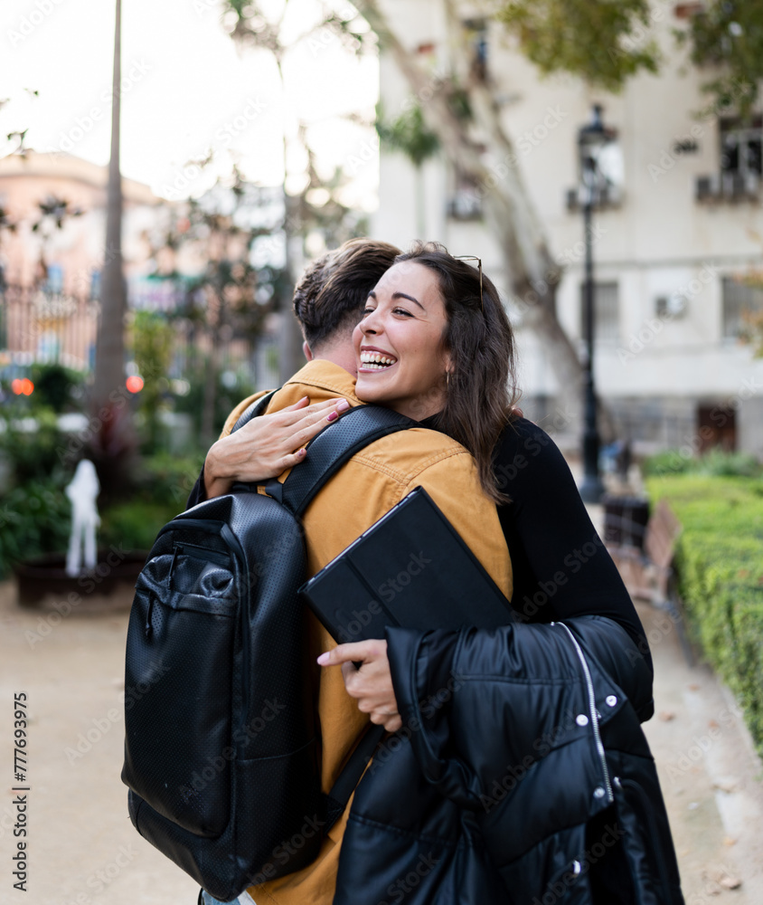 happy and smiling woman hugging a man happy and smiling woman hugging a man