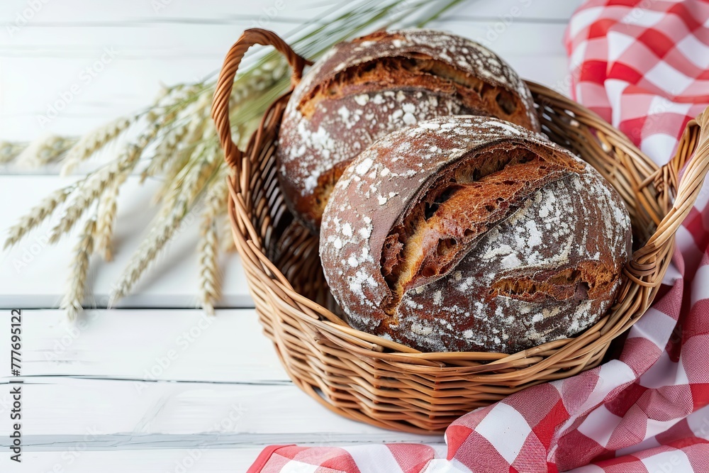 Baked rye bread in basket on wooden table