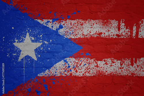 painted big national flag of puerto rico on a massive old brick wall