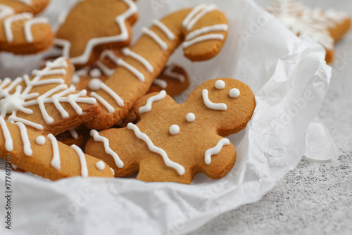 Gingerbread close-up on parchment paper. Gingerbread man. Christmas cookies.