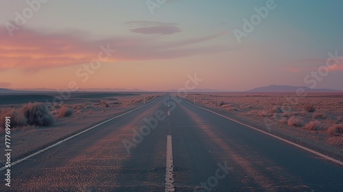 Empty asphalt road leading to the horizon at sunset. The road leading to the sunset mountain area.