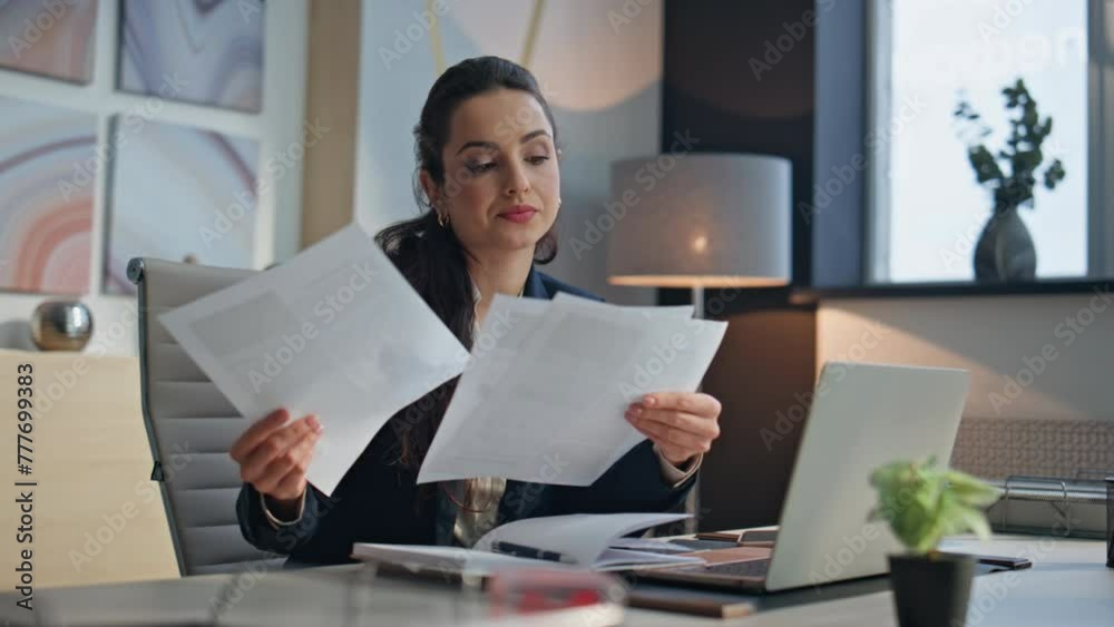 Tired lady study documents in creative office. Exhausted lawyer examining papers
