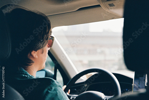 A man driving a car photo