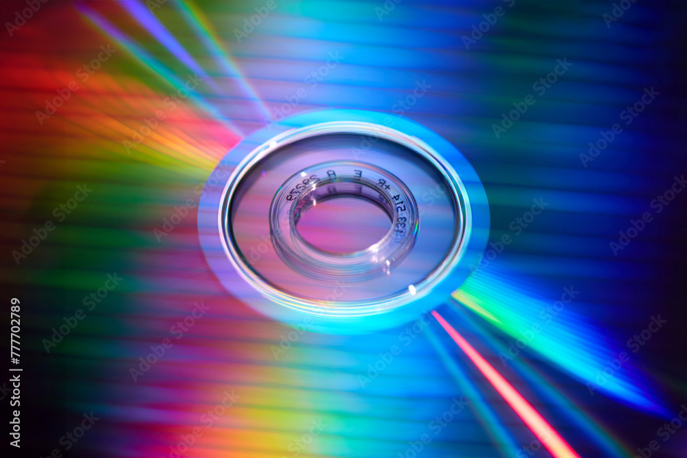 Rainbow reflection on smooth mirrored surface of CD disc Rainbow reflection on smooth mirrored surface of CD disc