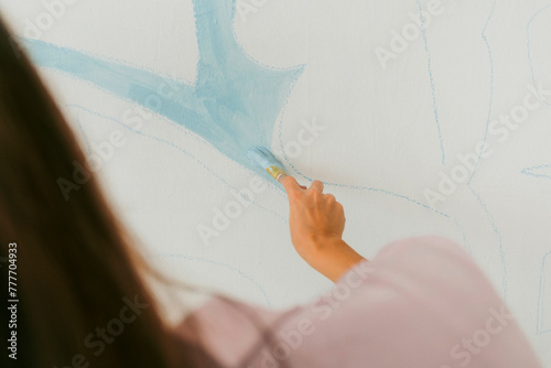 Artist hand painting.