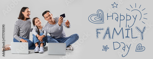 Happy family with gadgets t...