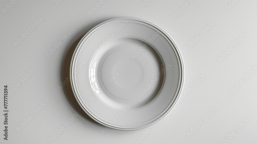Empty plate seen from above, placed on a white background. Empty plate seen from above, placed on a white background.