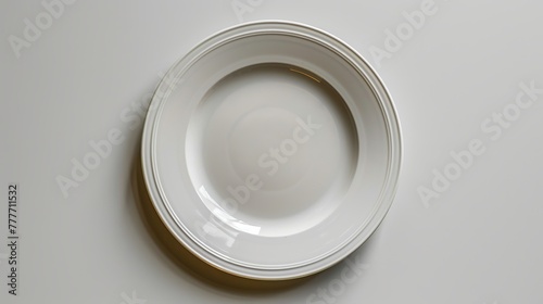Empty plate seen from above, placed on a white background.