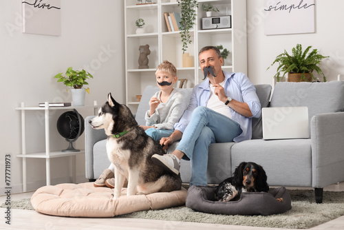 Father and son with dogs re...