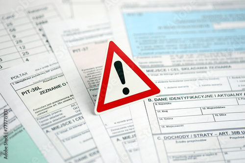 Concept of problems and troubles during tax reporting and taxpaying in poland. Accountant table with polish tax forms