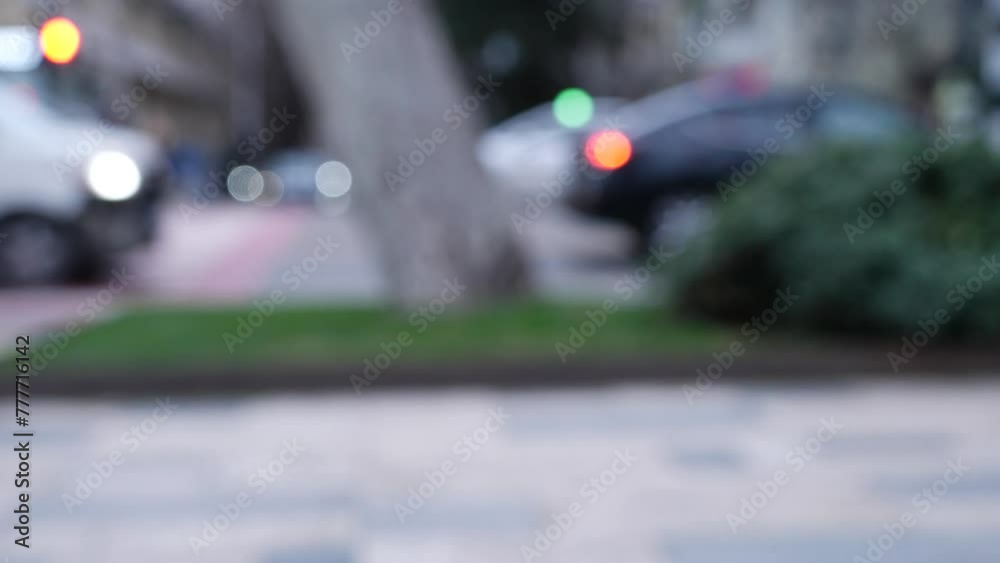 Blurred motion of pedestrians and vehicles on an urban street as evening sets in. Blurred motion of pedestrians and vehicles on an urban street as evening sets in.
