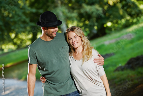 Couple, hug and walking in park portrait, love and commitment to relationship in outdoor nature. Happy people, bonding and embrace in marriage, romance and together on vacation or holiday date