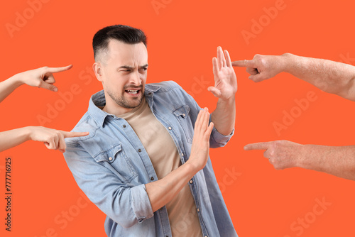 People pointing at young ma...
