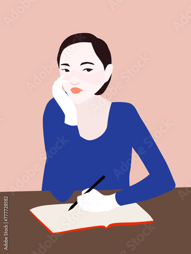 Woman writing a diary photo