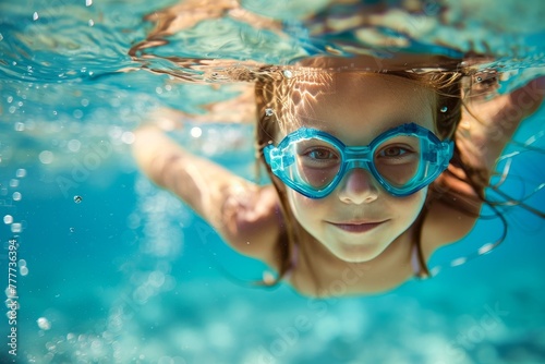 Underwater view of a little girl swimming in a pool