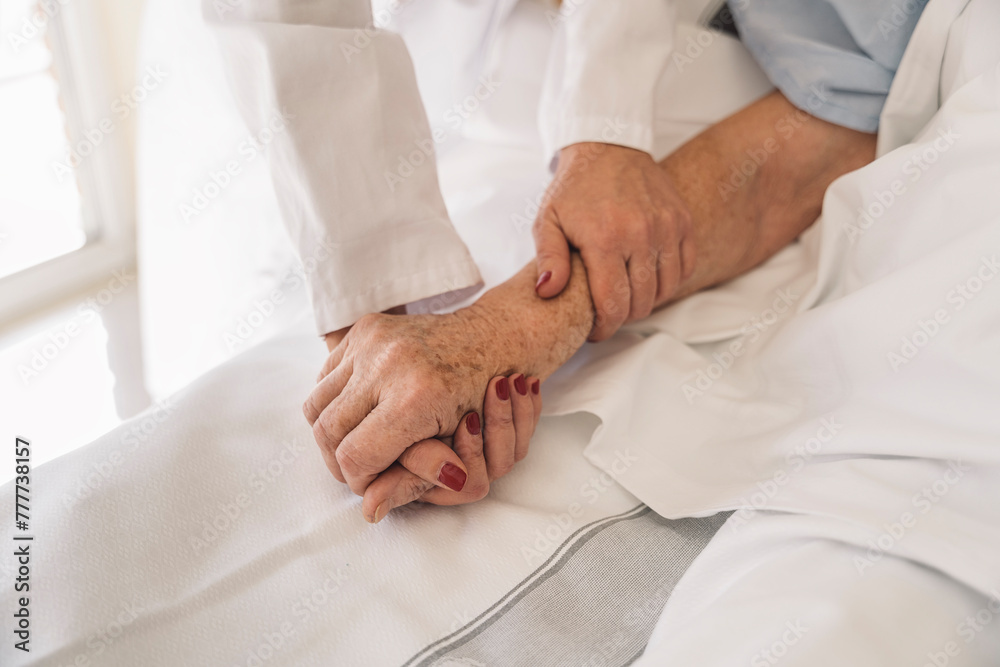 medical doctor holing senior patient's hands medical doctor holing senior patient's hands