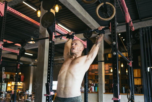 man doing CrossFit training in the gym photo