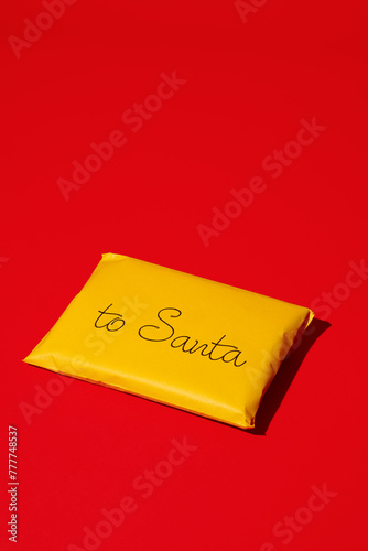 letter to santa in a yellow envelope