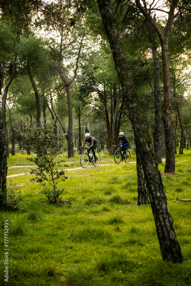 Two cyclists on gravel road Two cyclists on gravel road