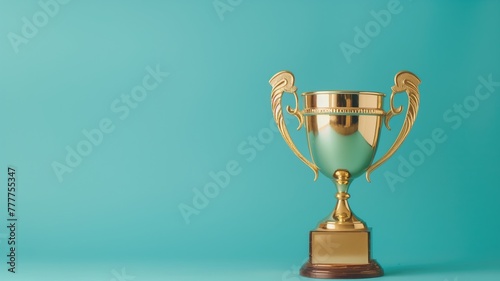 Golden trophy on teal blue background, symbolizing achievement and success