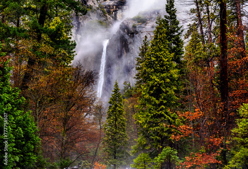 The lower cascade of the Yosemite falls in January with misty falls and some autumn colours 
