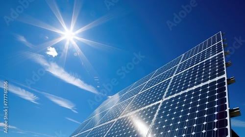 Solar panels glistening under radiant sun with clear blue sky in background