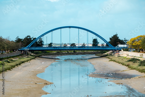 Landscape with the so-called Blue Bridge over the Iro river with little water in Chiclana de la Frontera, Cadiz, Spain photo