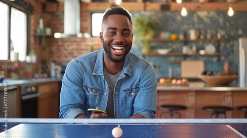Obraz na płótnie A man smiling while playing ping pong in a kitchen, AI