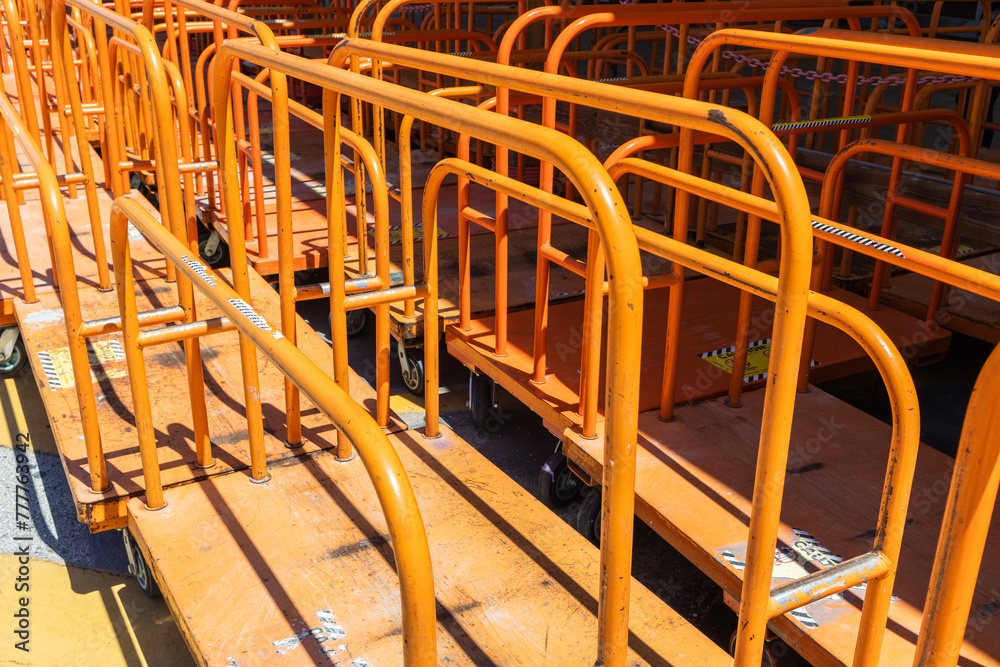 wide angle shot of carts lined up in a row, lumber carts with copy space wide angle shot of carts lined up in a row, lumber carts with copy space
