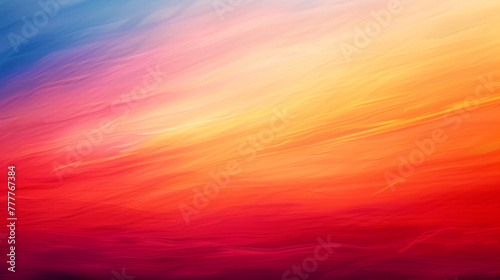 A vibrant, abstract gradient of warm colors, evoking a sense of a vividly colored sky during sunrise or sunset