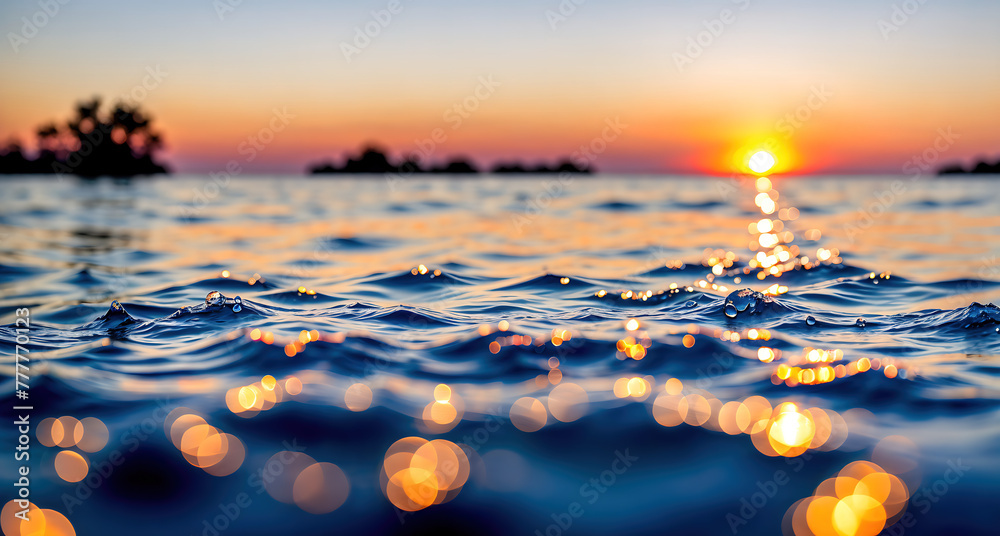 A beautiful sunset over a body of water, with the suns rays reflecting off the waters surface.