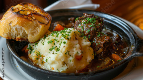 Traditional irish stew with mashed potatoes and bread