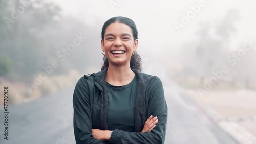Woman, portrait and exercise outdoor with arms crossed for wellness, run or hiking with cardio in nature. Confident, smile with fitness and sports training for health, athlete and pride in workout photo