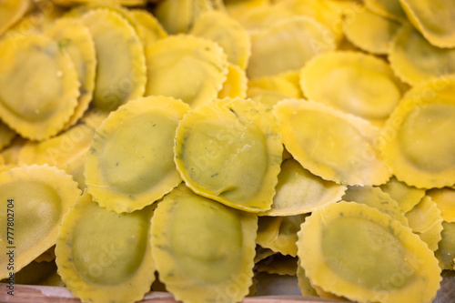 Italian food, fresh homemade stuffed pasta tortelli or ravioli dumplings ready to cook, Milan, Lombardy, Italy photo