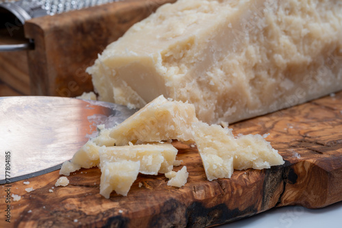 Traditional italian food - 22 months aged in caves Italian parmesan hard cheese from Parmigiano-Reggiano, Italy