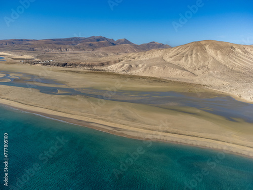 Aerial view on sandy dunes and turquoise water of Sotavento beach  Costa Calma  Fuerteventura  Canary islands  Spain in winter