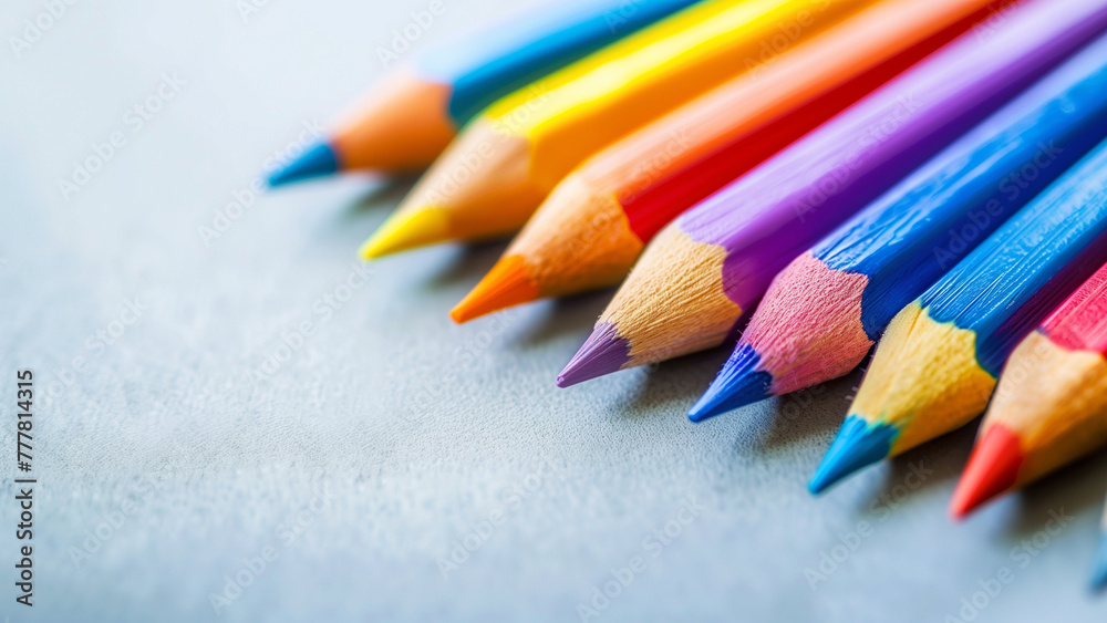 Colorful pencils on a blue background, close-up. Colorful pencils on a blue background, close-up.