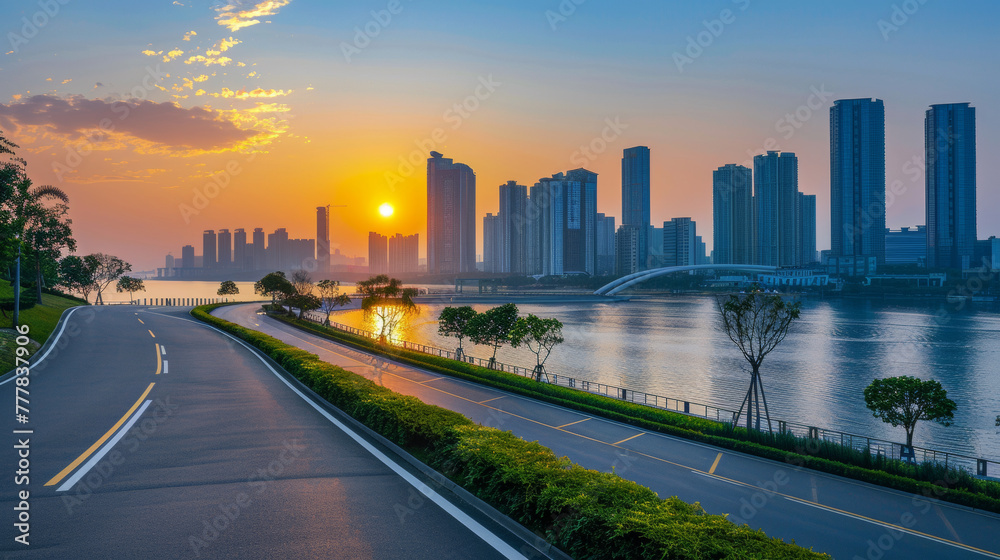 Asphalt road and pedestrian bridge with modern city skyline at sunset in Ningbo Zhejiang Province China. 