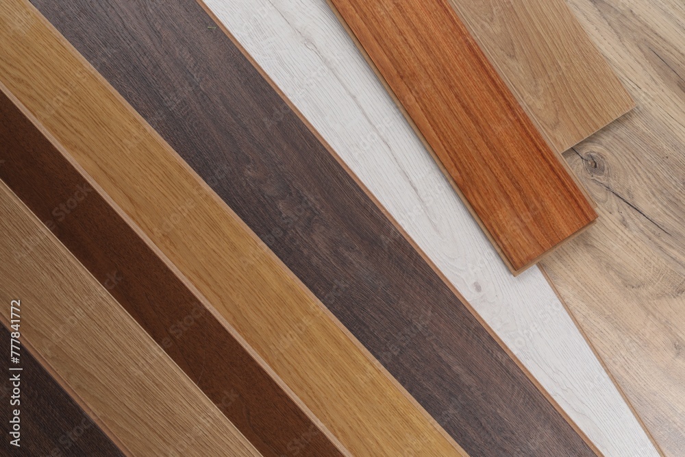 Different samples of wooden flooring as background, top view Different samples of wooden flooring as background, top view