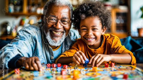 An elderly man and young child smiling  playing a colorful board game together  enjoying quality family time indoors.